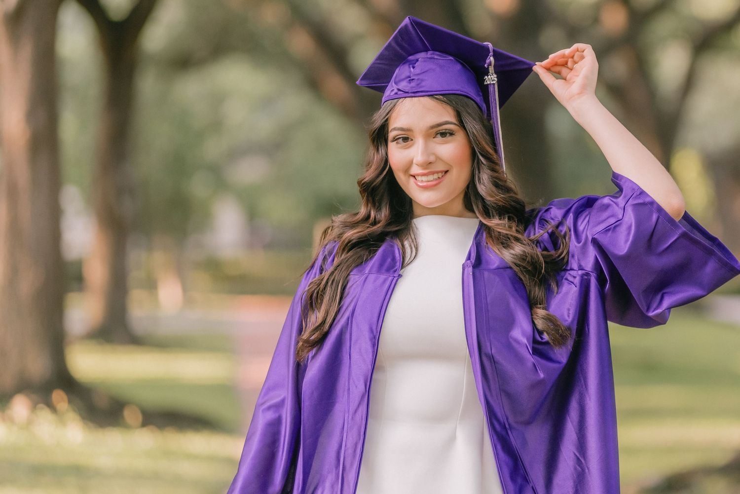 Series of outdoor graduation photos featuring purple academic regalia and natural scenery.
