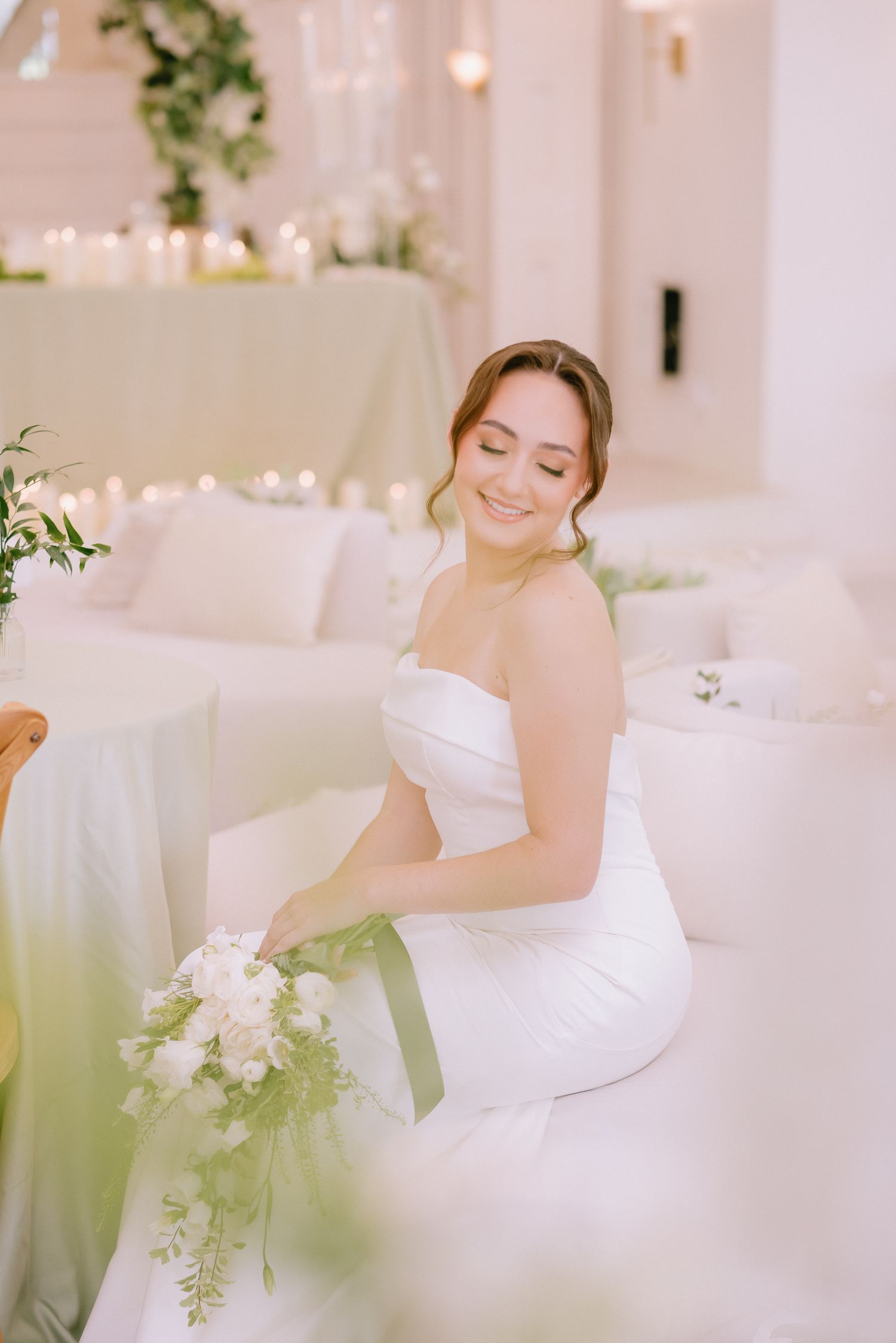 Intimate bridal portrait in white strapless gown with soft natural lighting.