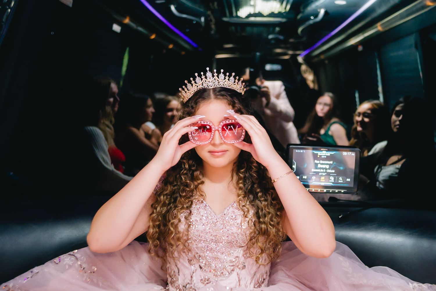 Playful portraits taken inside a dark venue with dramatic lighting effects.