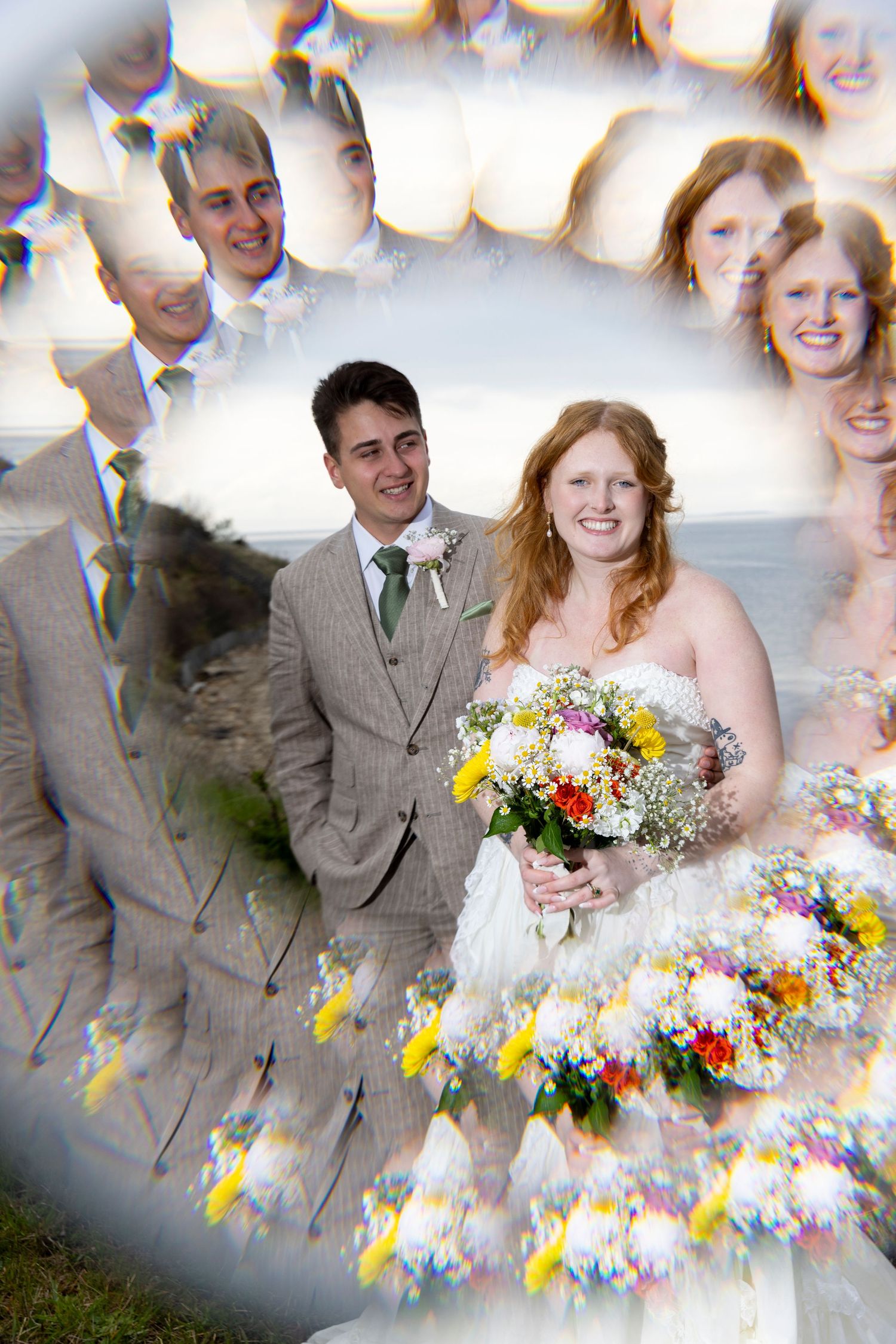 A bride holding a colorful bouquet stands with her groom in a wedding photo with a creative circular mirror reflection effect.