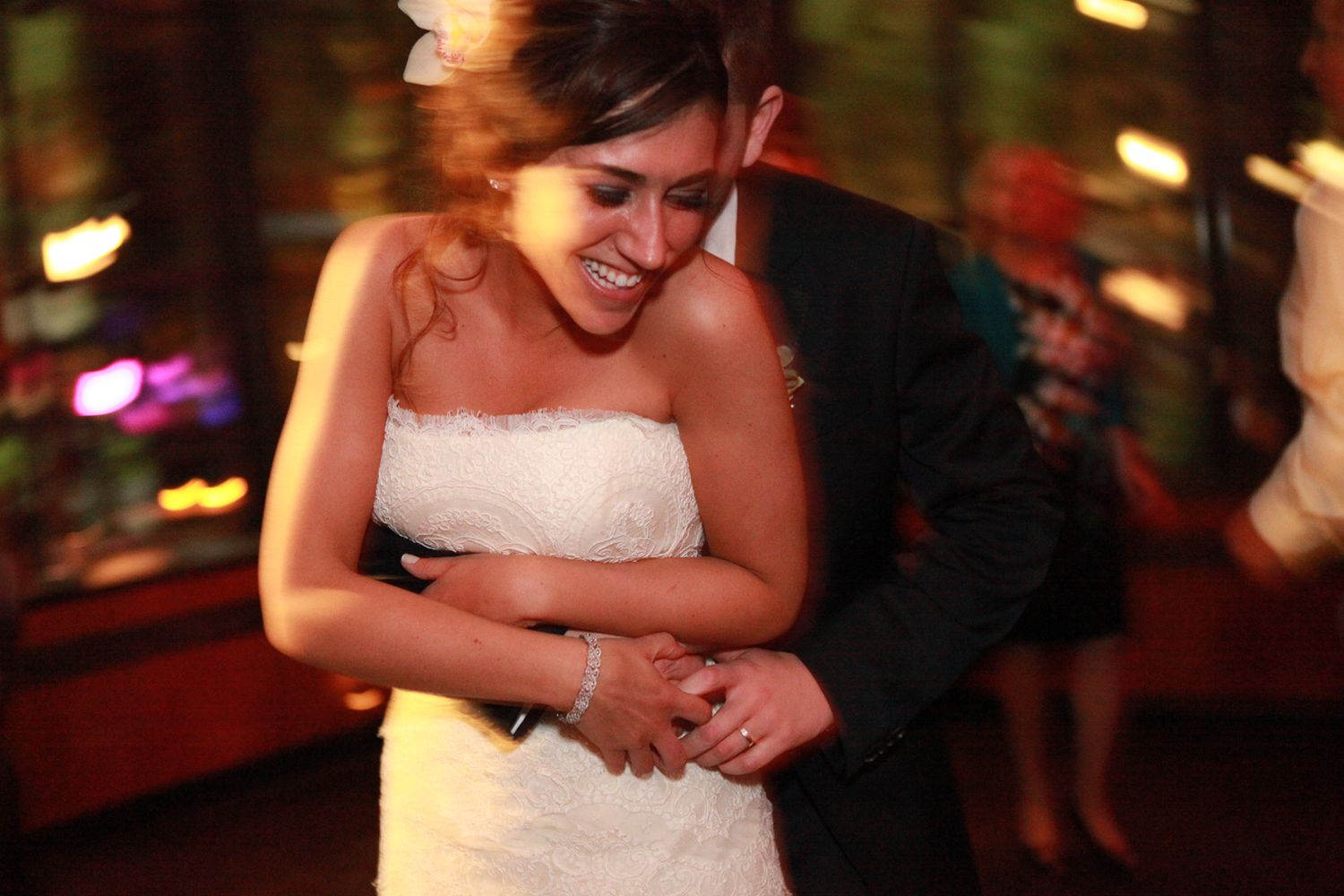 Romantic moment captured on the dance floor at wedding reception.