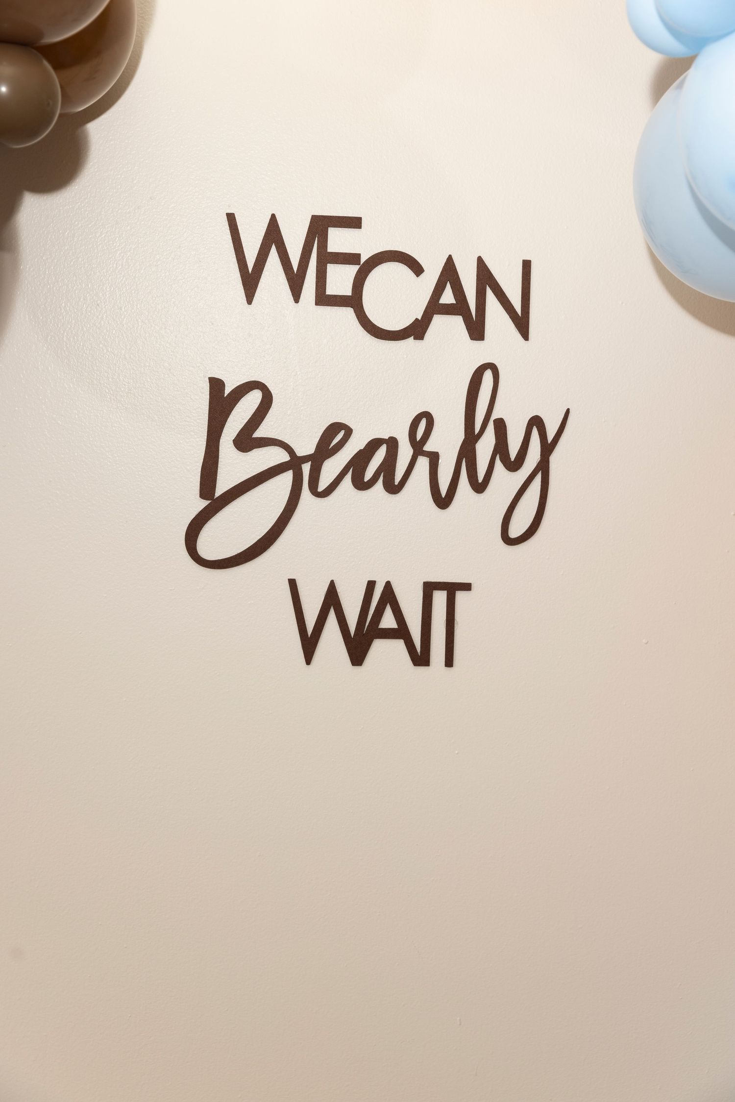 A series of handwritten text fragments showing 'we can wait' in brown ink against a light background.