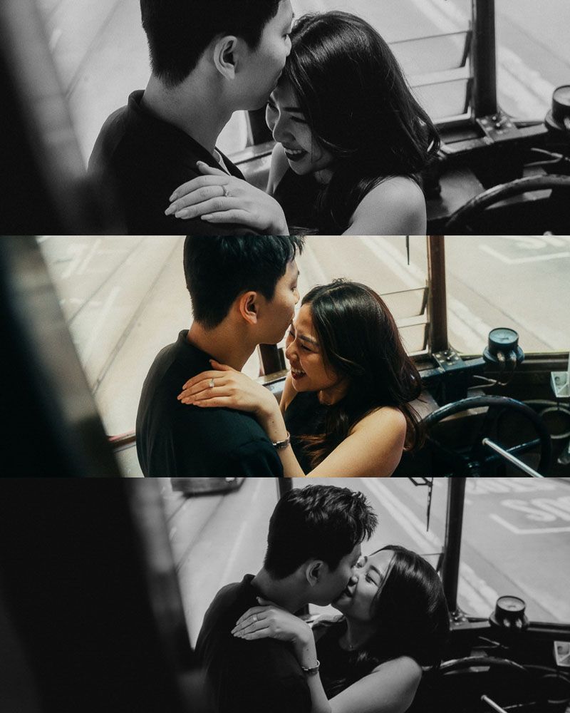 Intimate moments captured between a couple on a dark leather couch.