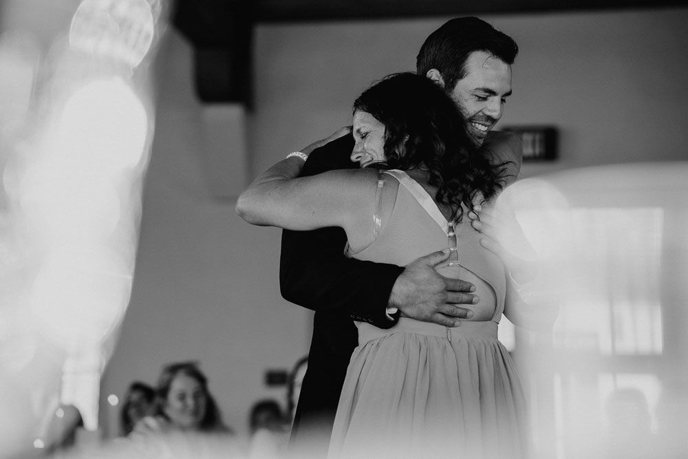 Black and white moment of an intimate dance at a wedding celebration.