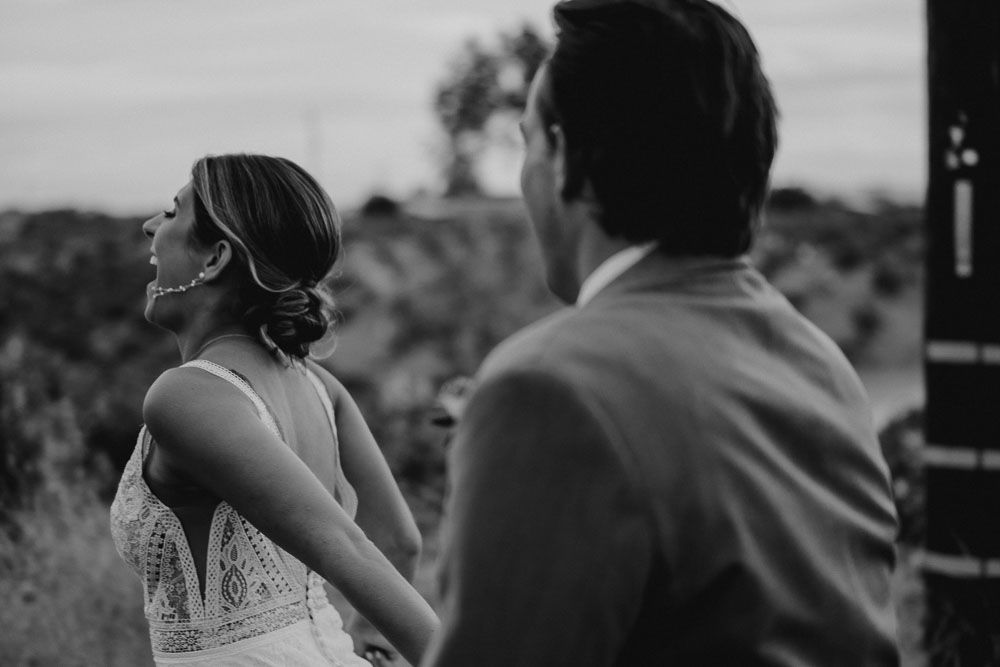Black and white candid shots of a couple during their wedding celebration.