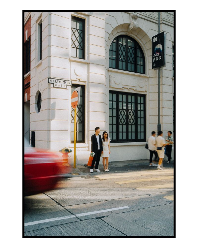 Street photography of a classic building exterior with arched windows and architectural details.