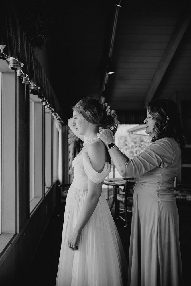 Black and white images show wedding preparation moments in an indoor setting.