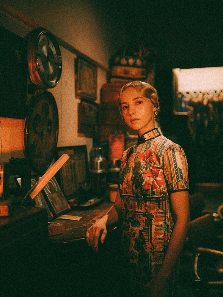 Retro scene in dim lit Asian restaurant featuring traditional decor and vintage styling.