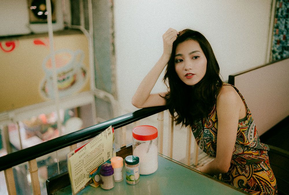 Interior cafe scene with retro aesthetics and vintage decor elements.