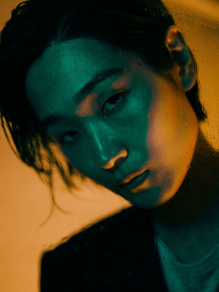 Moody portrait series with teal and orange lighting creating atmospheric shadows.