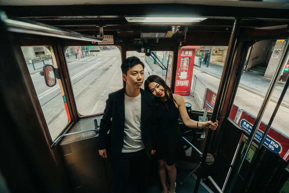 A couple inside a Hong Kong tram