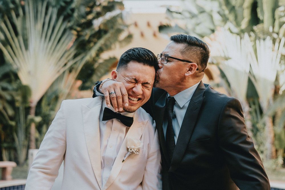 Candid moments at an outdoor wedding with palm trees in the background.