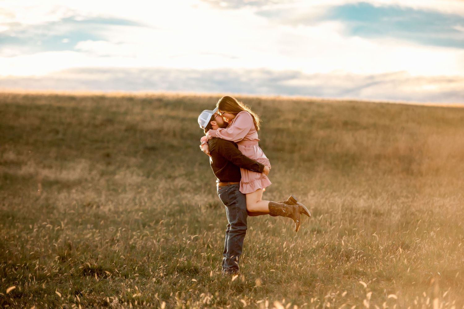Candid moments captured in an open field during golden hour.