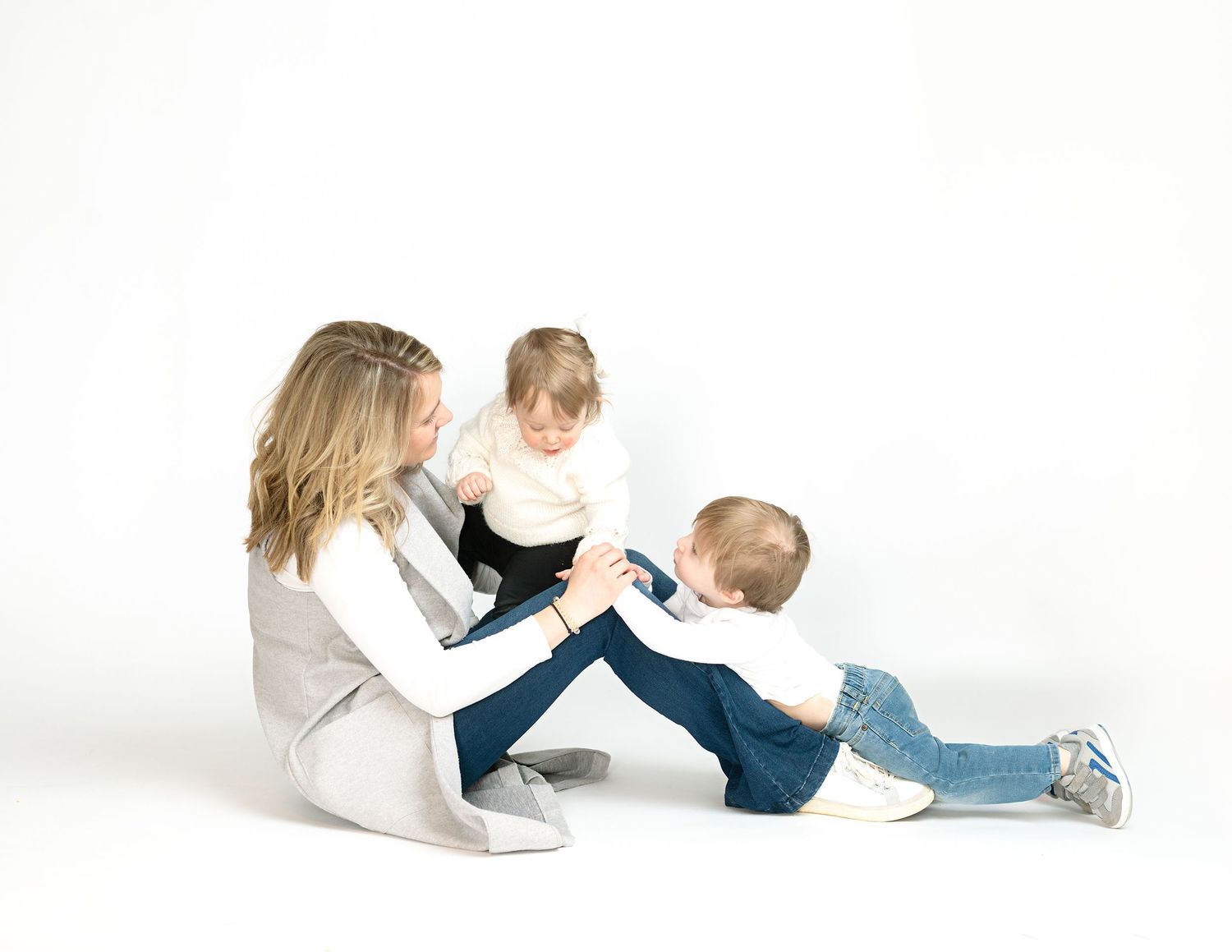 Series of minimalist photos showing tender parent-child moments on white background.