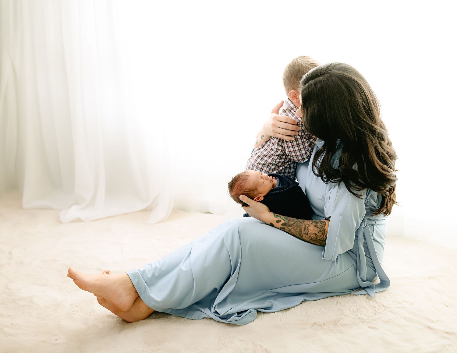 Artistic maternity portraits in soft natural light against white background.