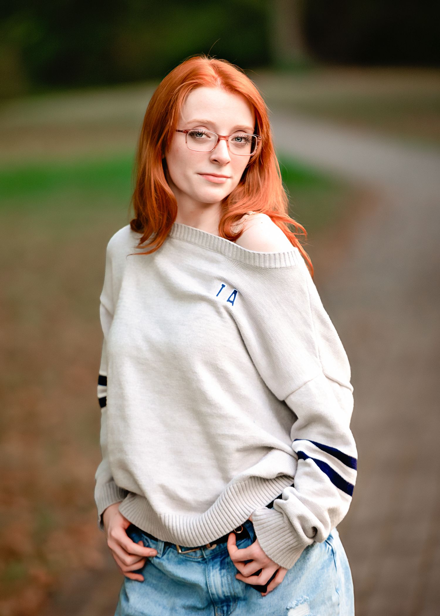 Casual fashion series in cozy cream sweater and jeans against natural outdoor backdrop.