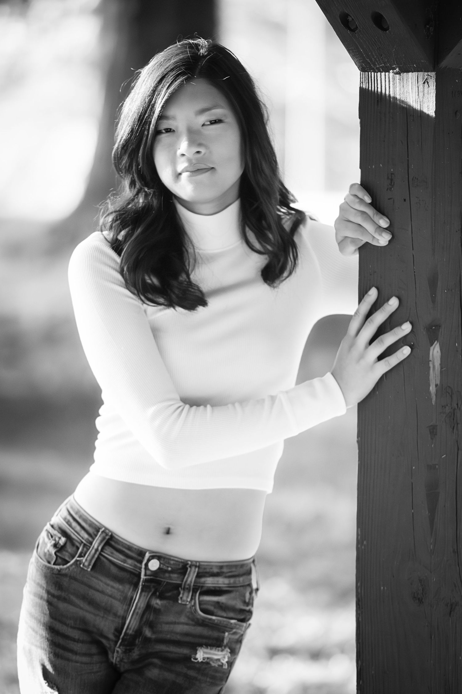 Black and white portrait series showing dynamic poses against a dark background.