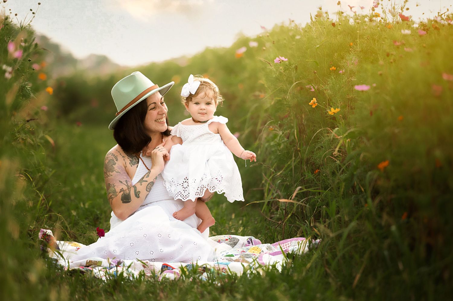 Candid lifestyle photography session in a sunlit meadow at golden hour.