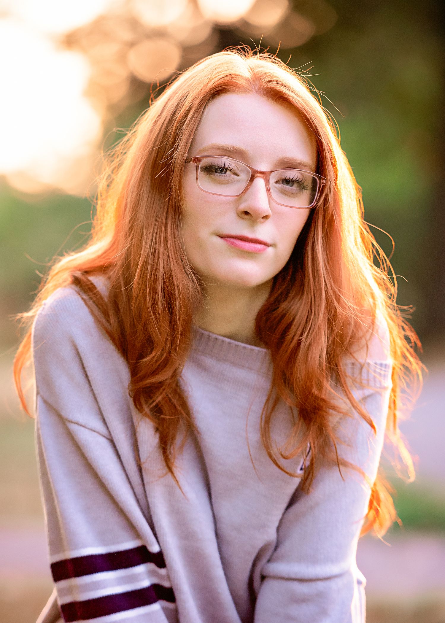 Autumn portrait series in soft beige sweater with warm sunset lighting.