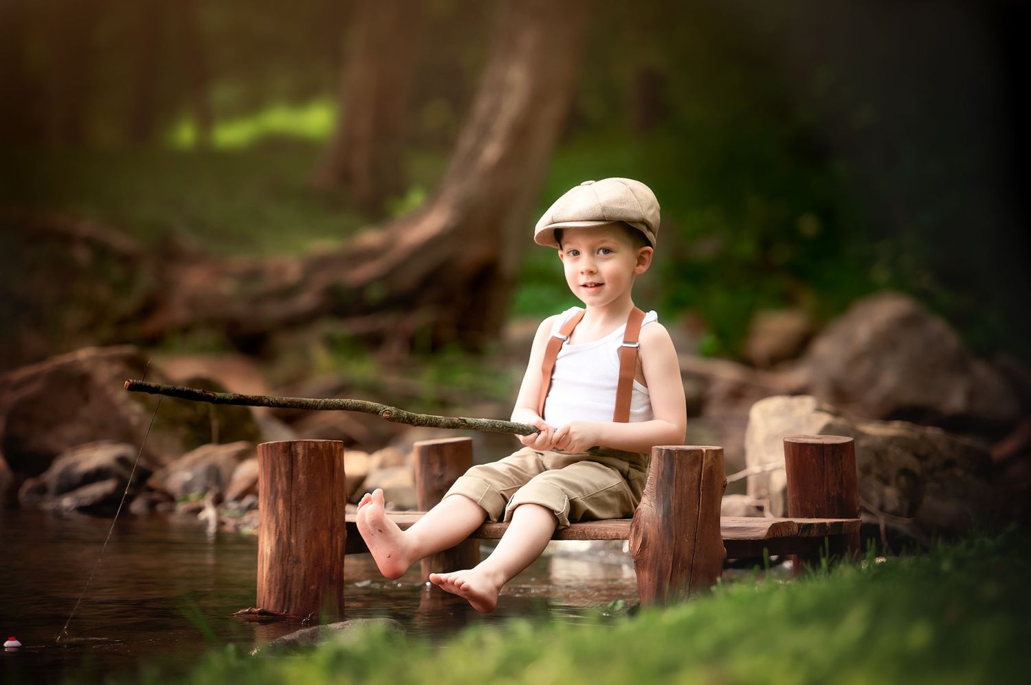Child in vintage outfit sitting on wooden dock by pond.