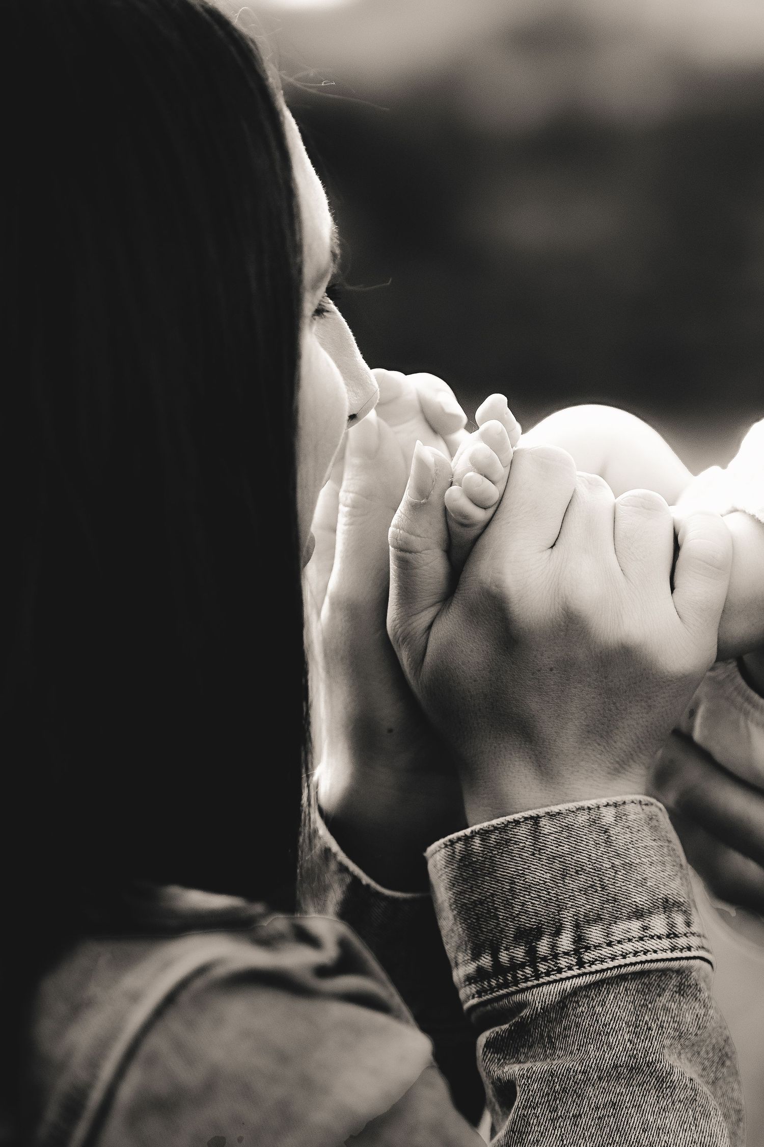 Black and white close-up sequence showing a tender kiss between two people.