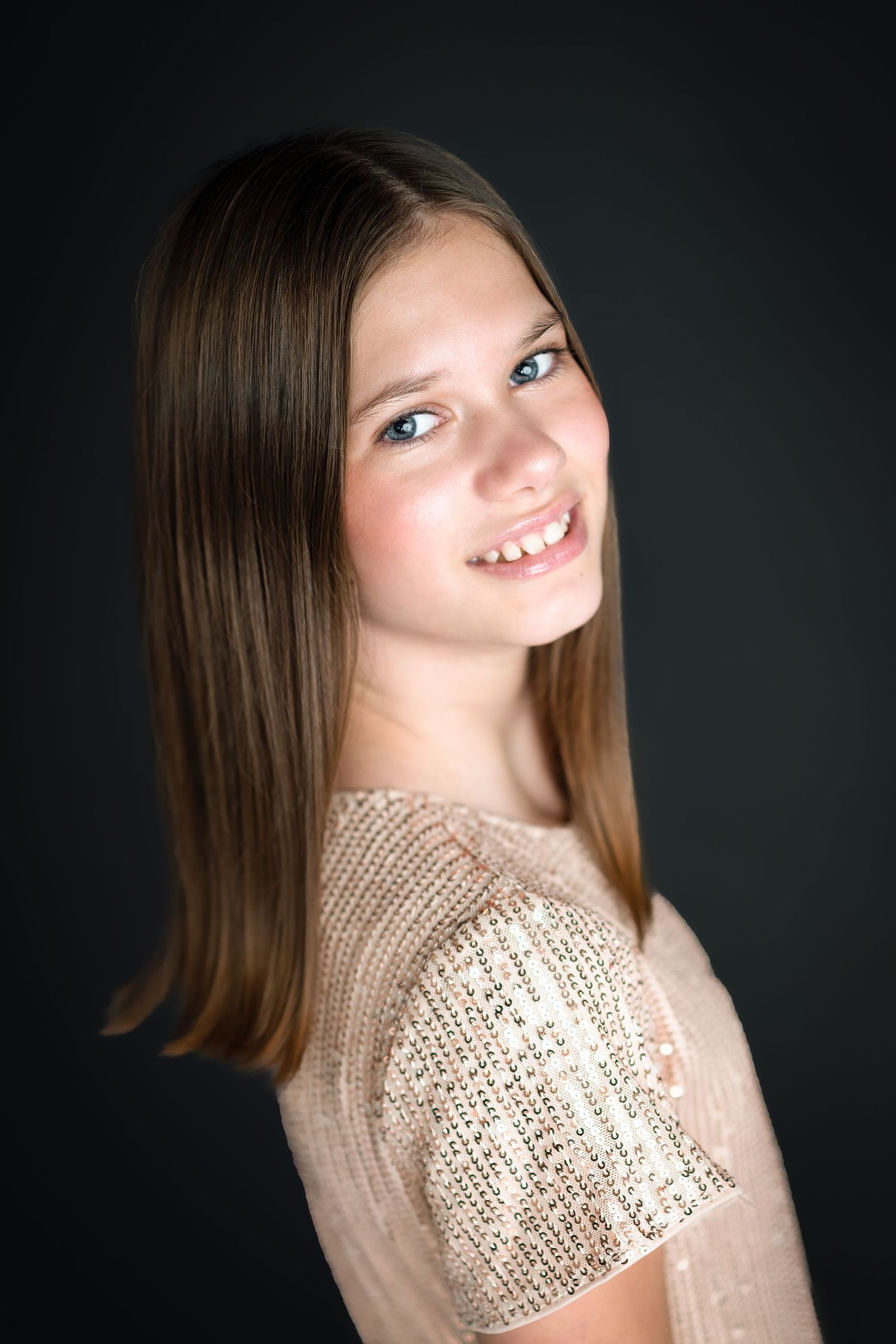 Studio portraits featuring a person in a sequined top against a dark background.