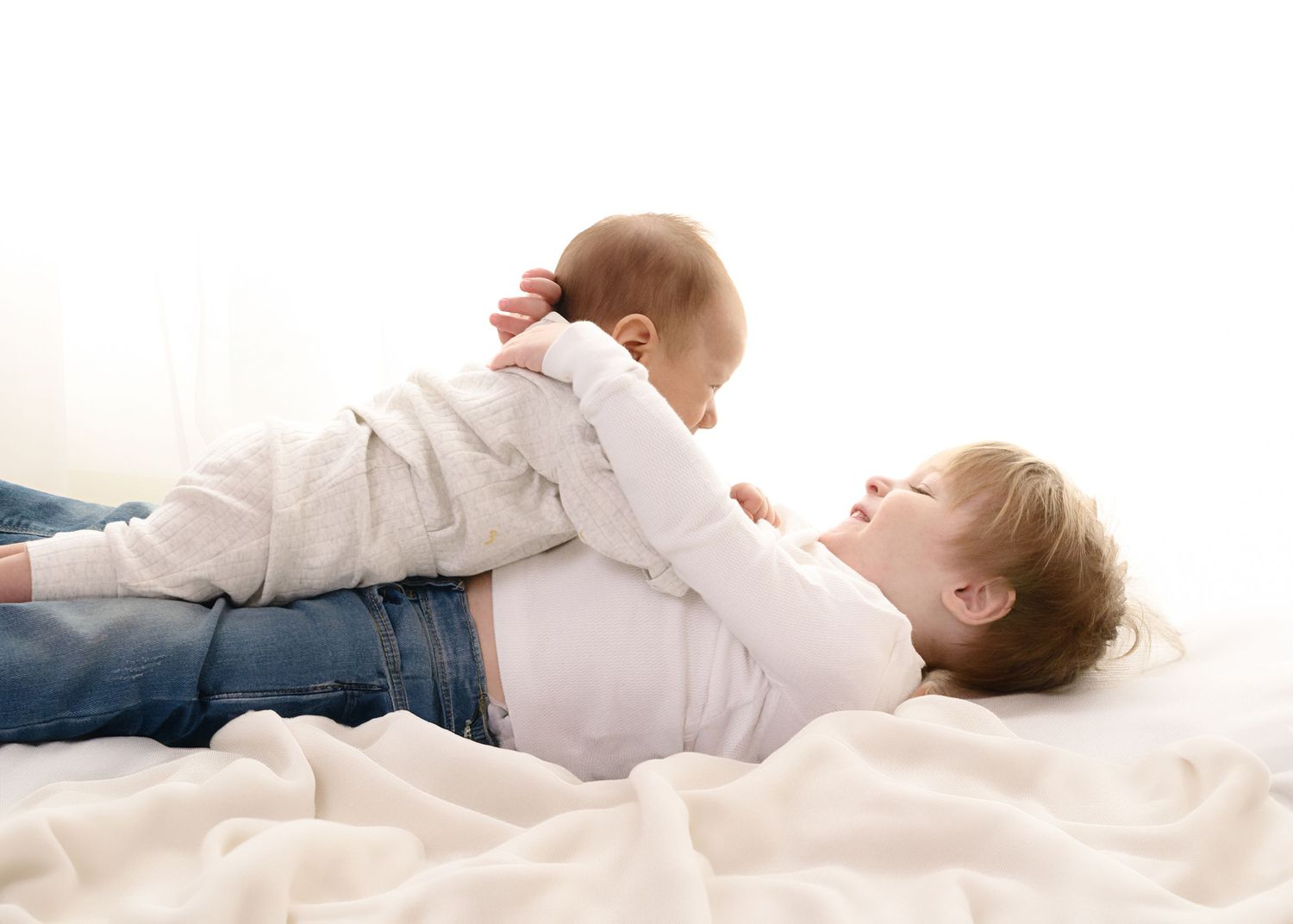 Series of candid lifestyle photos showing siblings playing and bonding on white background.