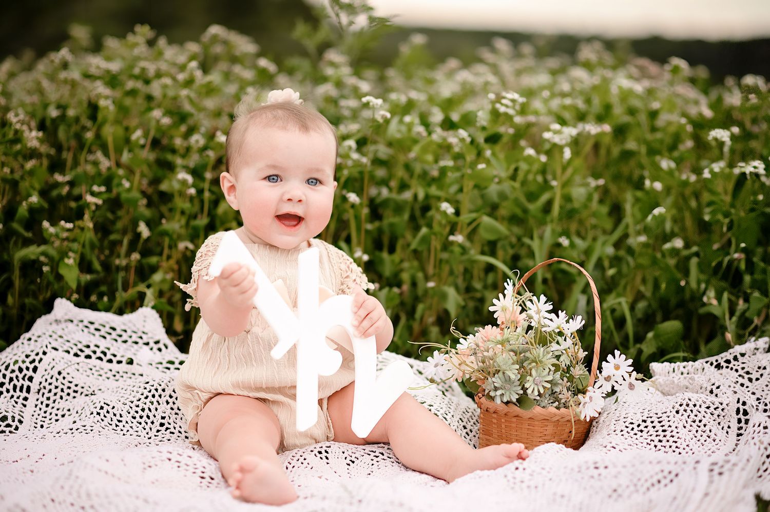 Sweet portrait session in field of white wildflowers with lace details.
