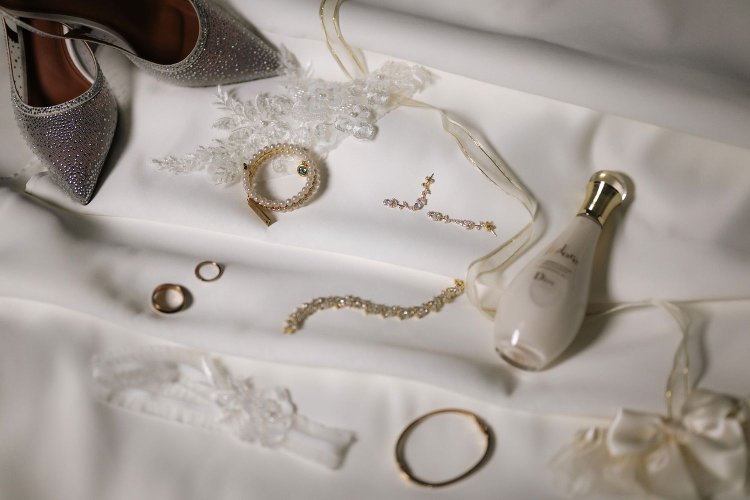 Jewelry and accessories on a white surface.