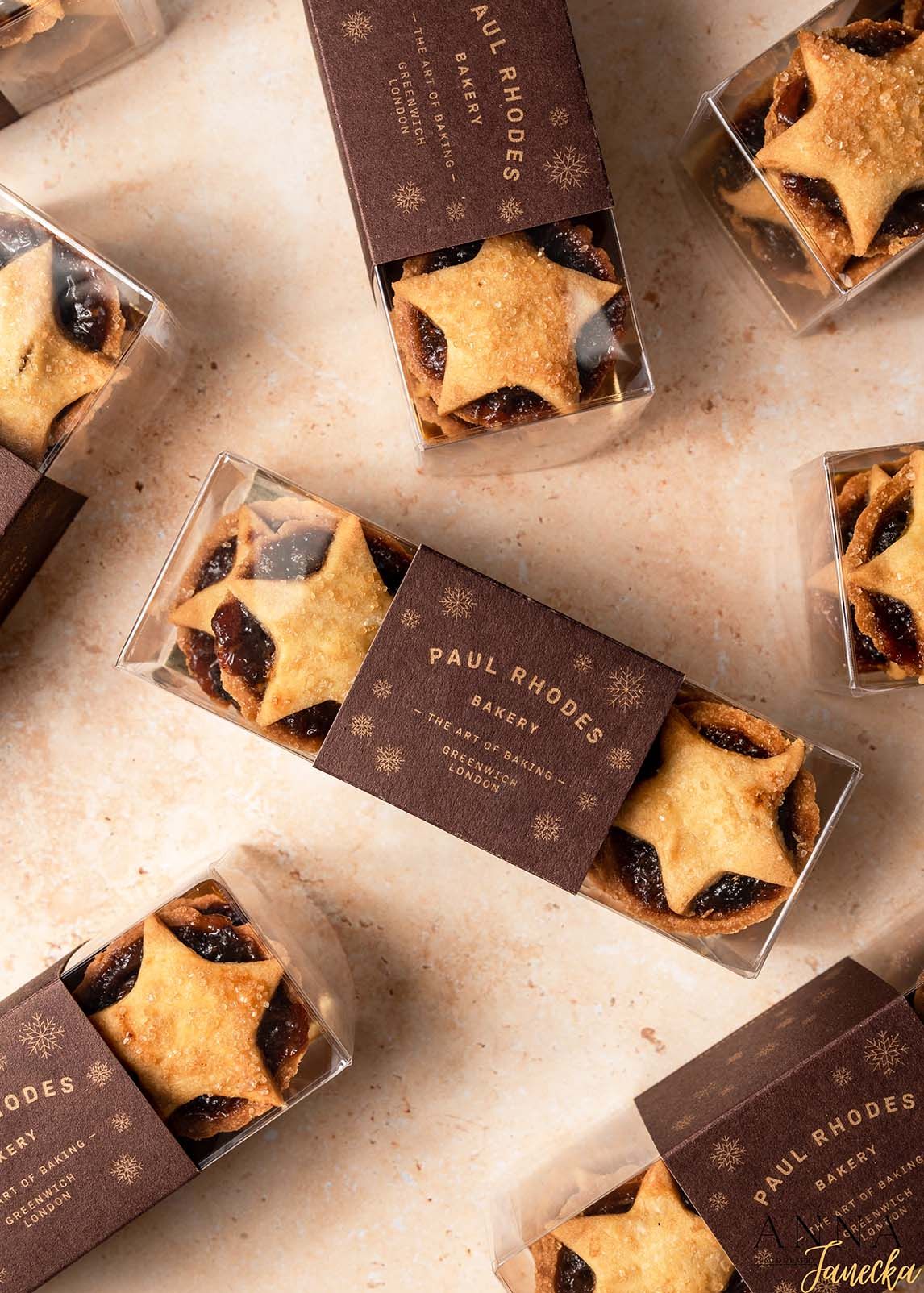Star-shaped cookies in clear gift boxes with Paul Rhodes bakery branding.