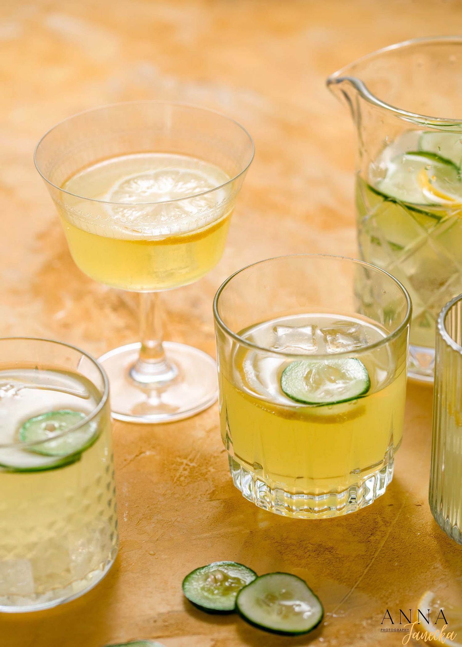 Refreshing cucumber cocktails served in various glassware with lime garnish.