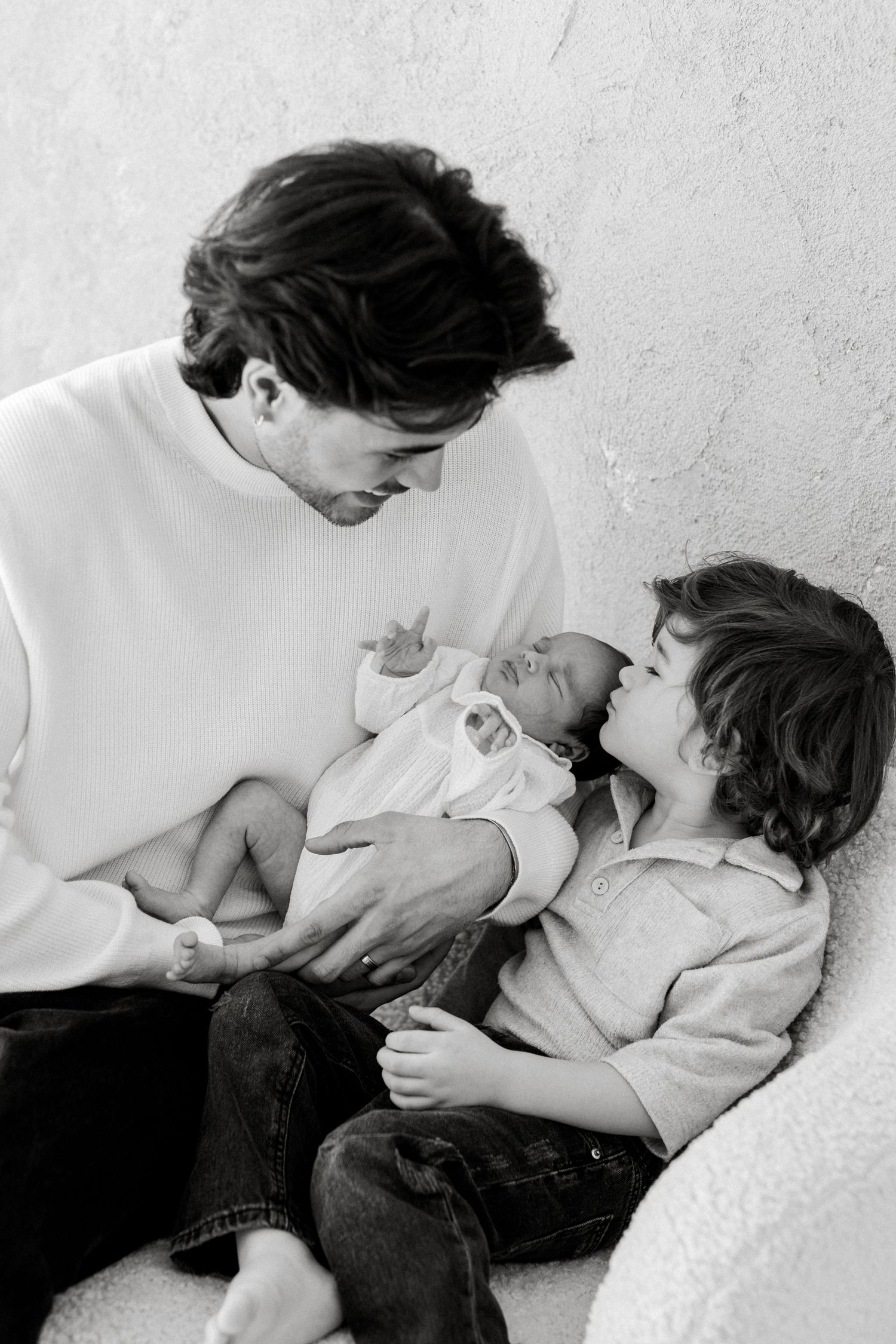 A series of black and white romantic photographs showing an intimate couple embracing in tender moments.