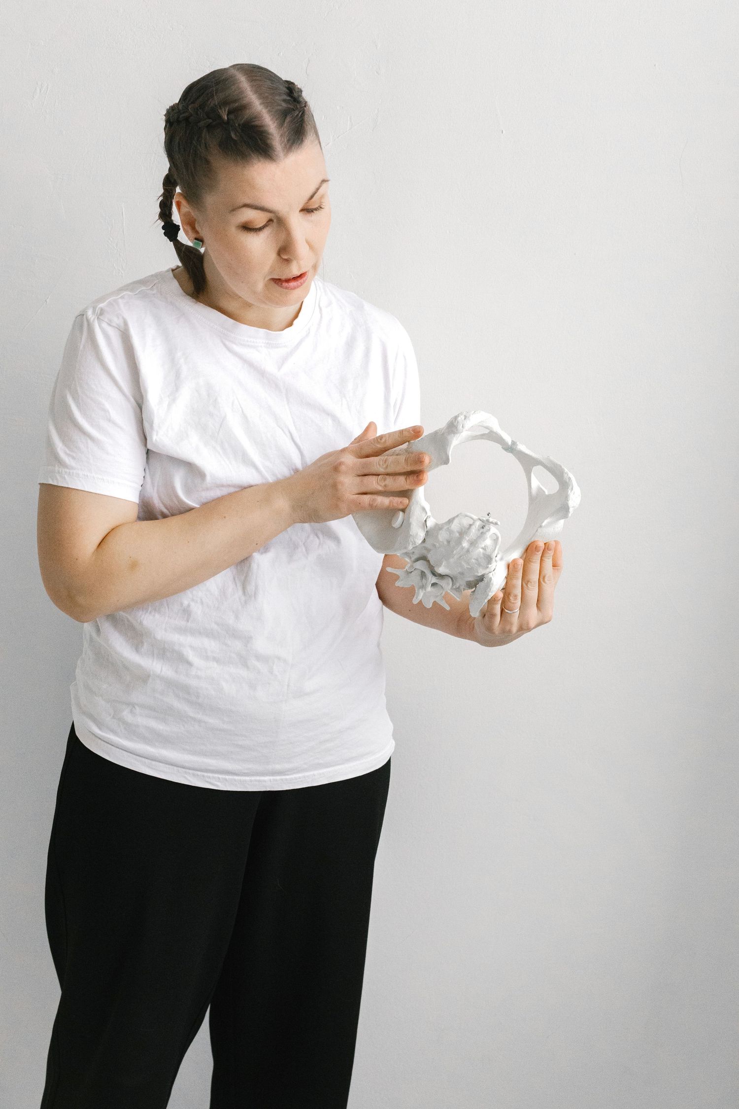 Series of images showing someone examining white paper or tissue samples.
