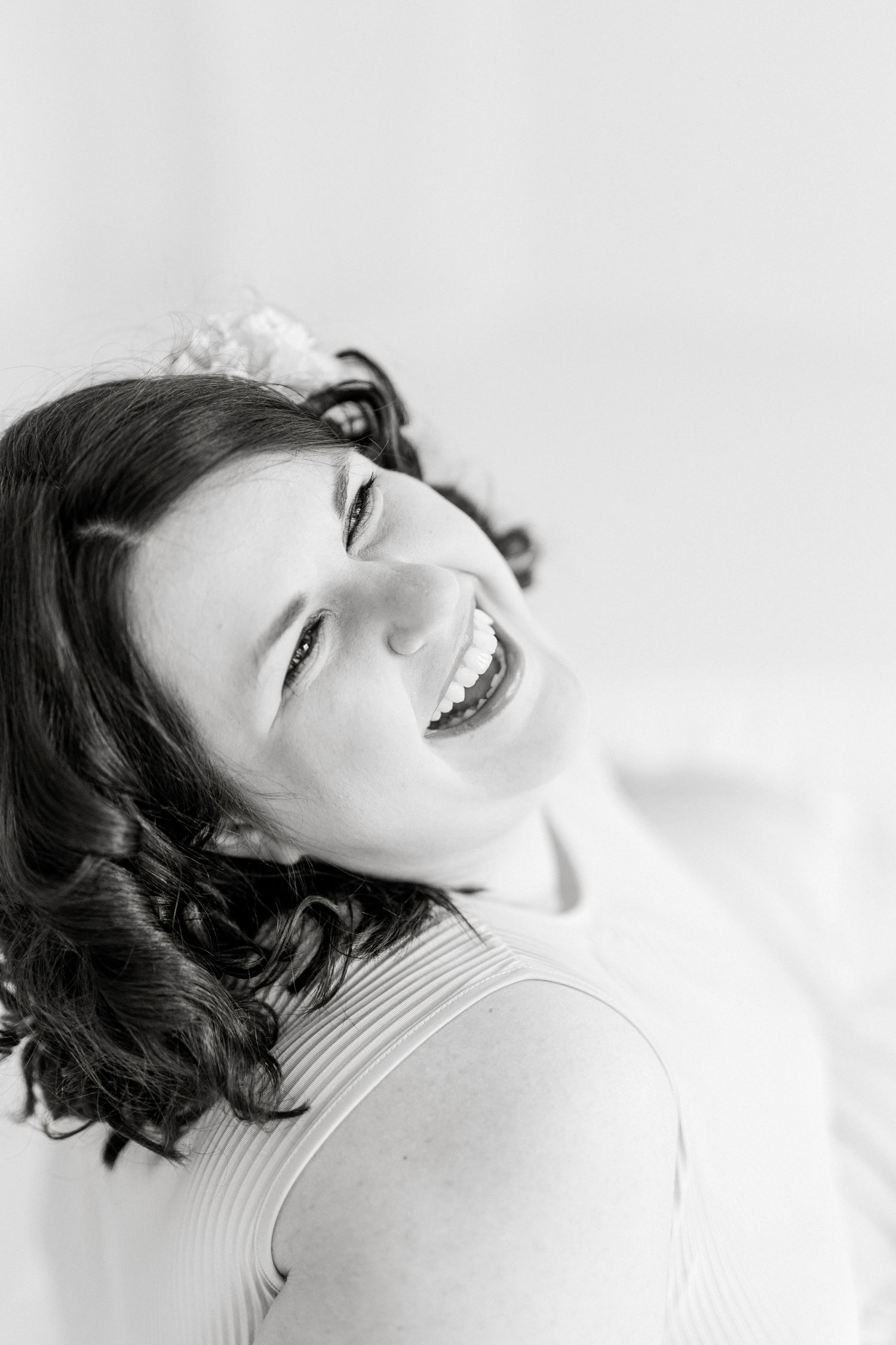 Artistic black and white portraits showing joyful expressions and natural emotion.