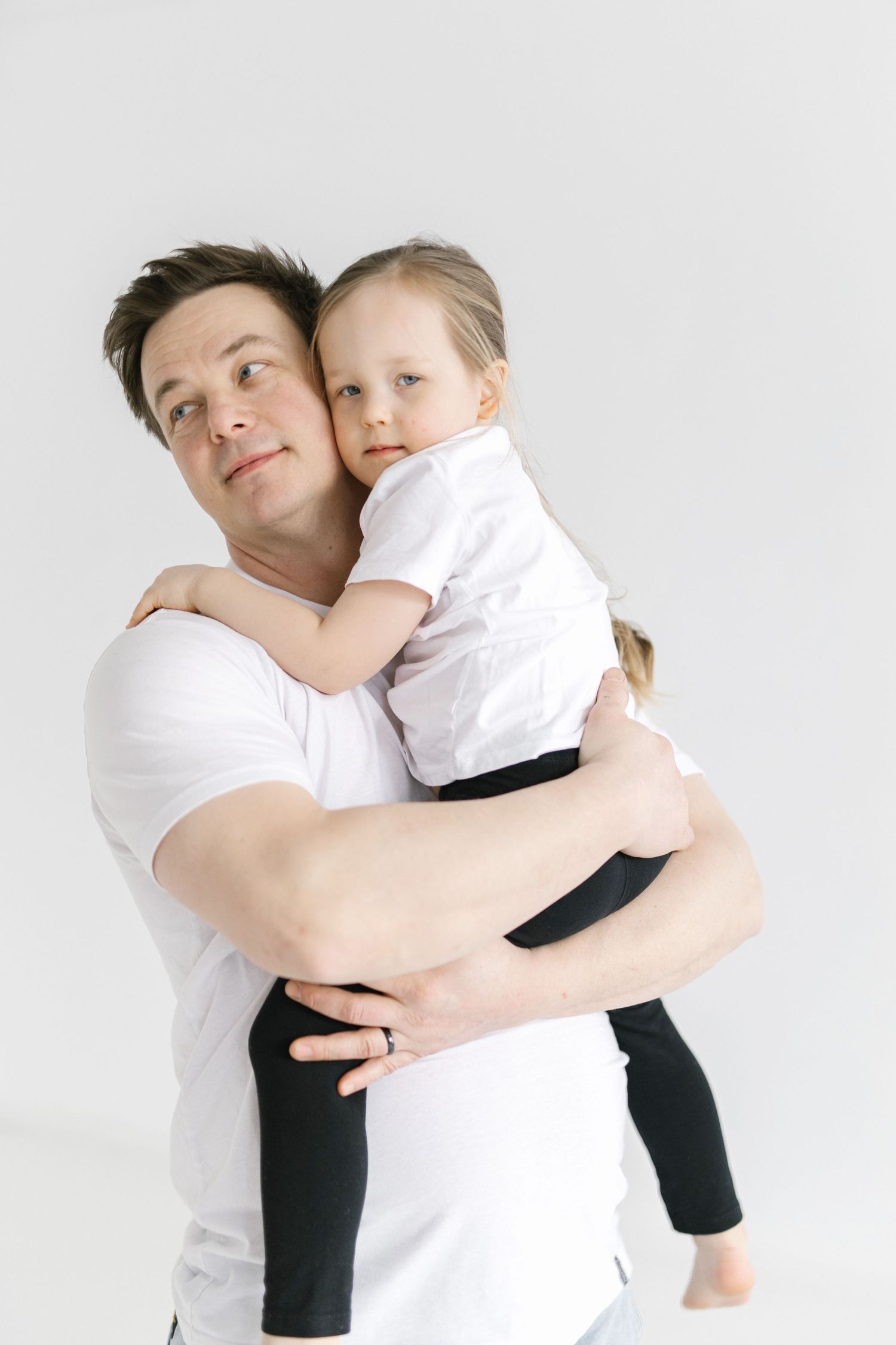 A series of four tender embrace photos showing parent and child hugging against a white background.