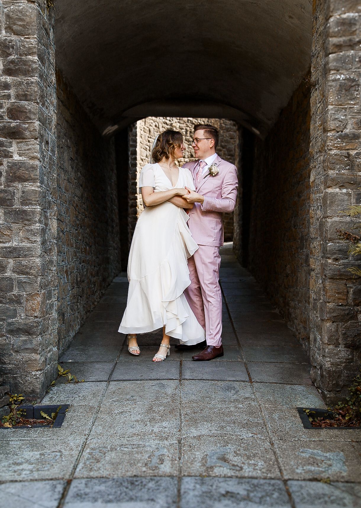 Romantic dance sequence showing tender moments in a stone tunnel setting.