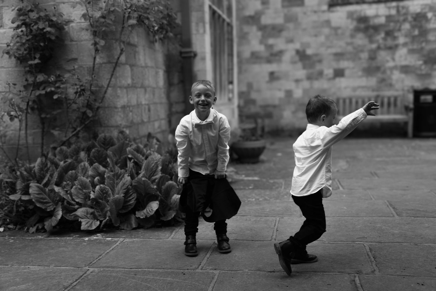 Dynamic black and white shots capture energetic movement across a stone patio.