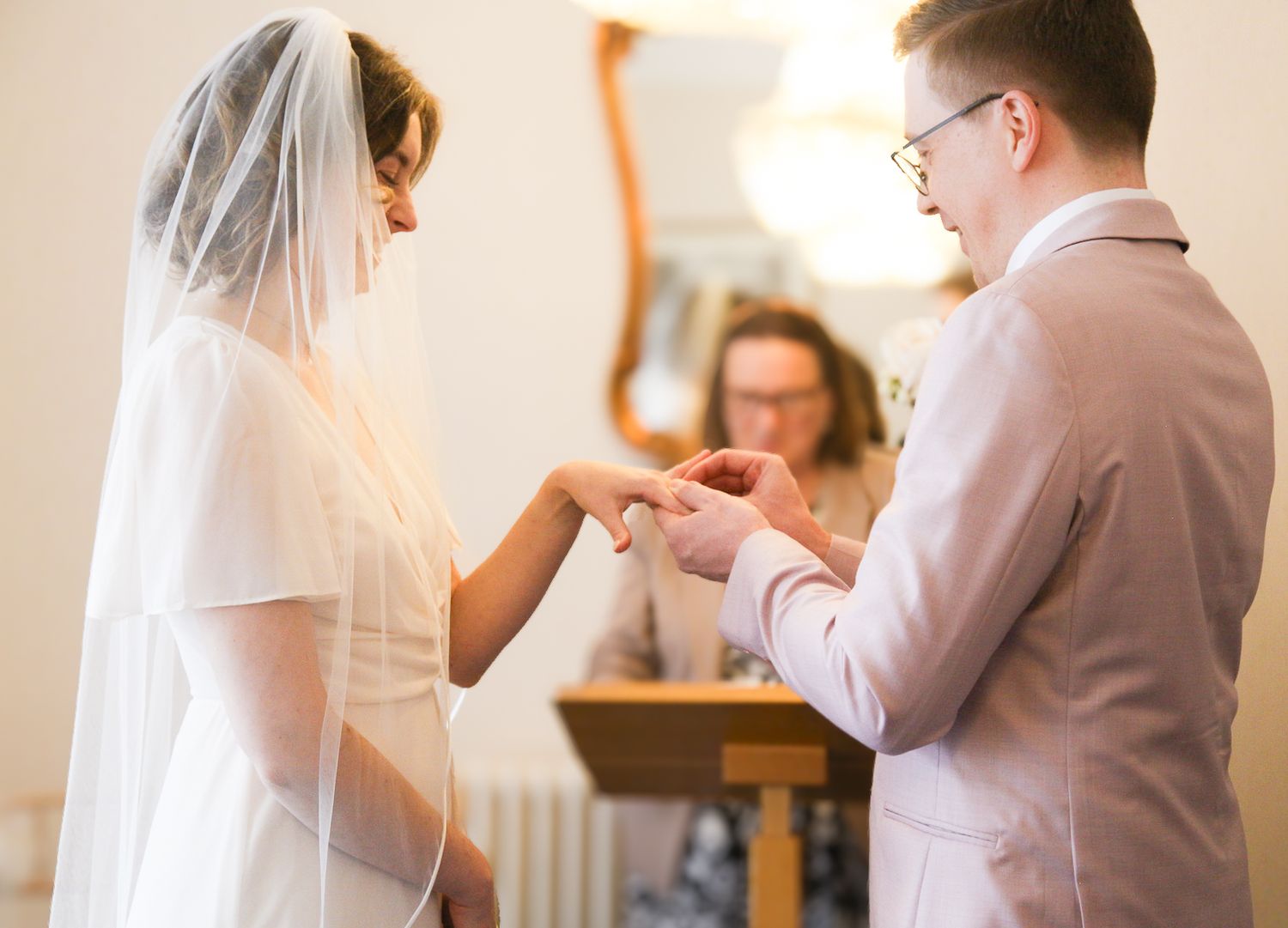 Sequence of photos showing couple during wedding document signing ceremony.
