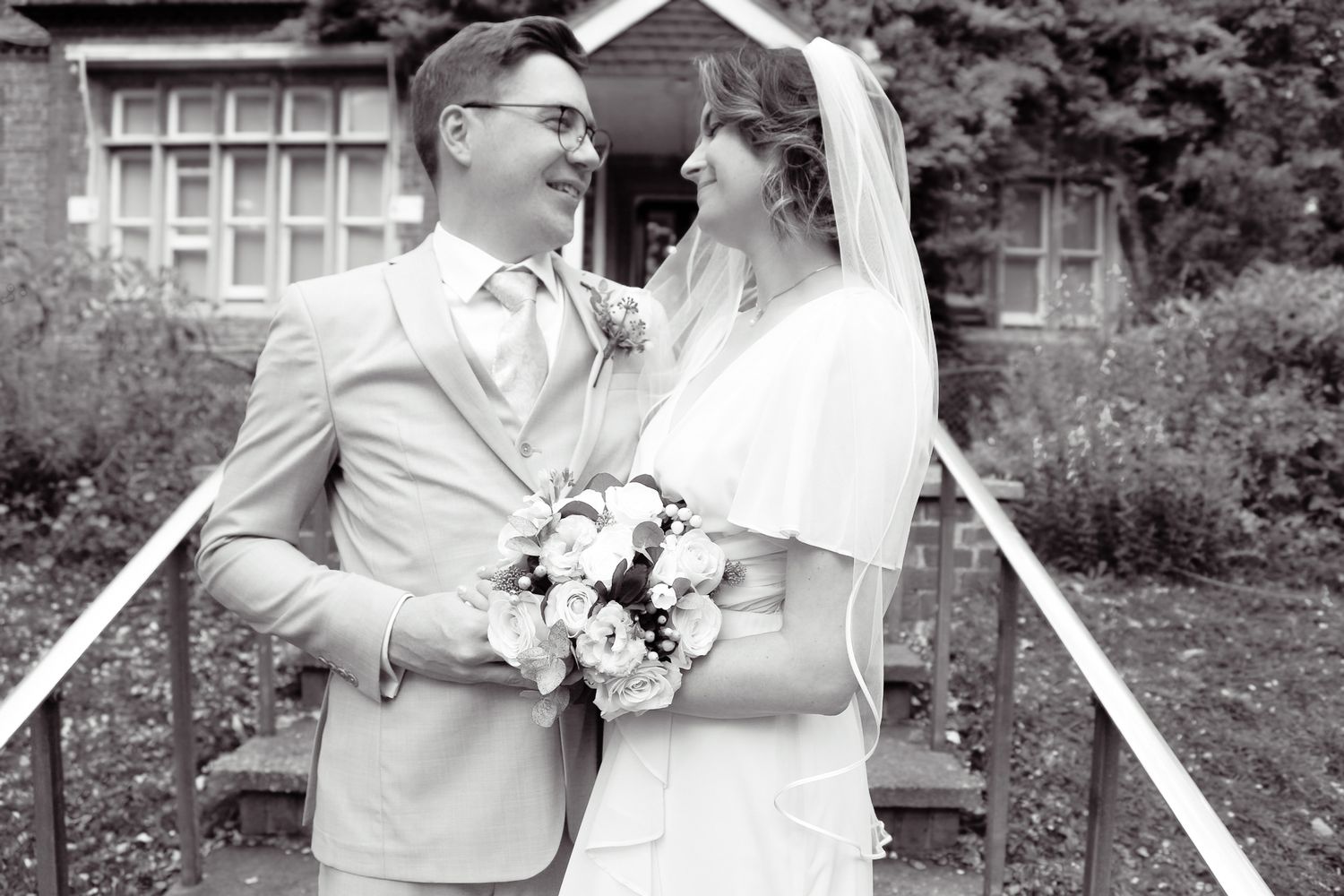 Wedding ceremony photos captured in a garden setting with natural light.