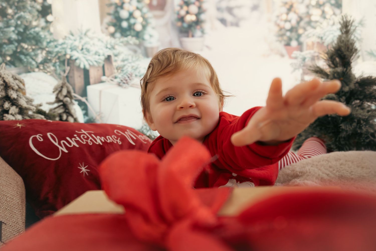Festive Christmas scene with red and white decor and holiday decorations.