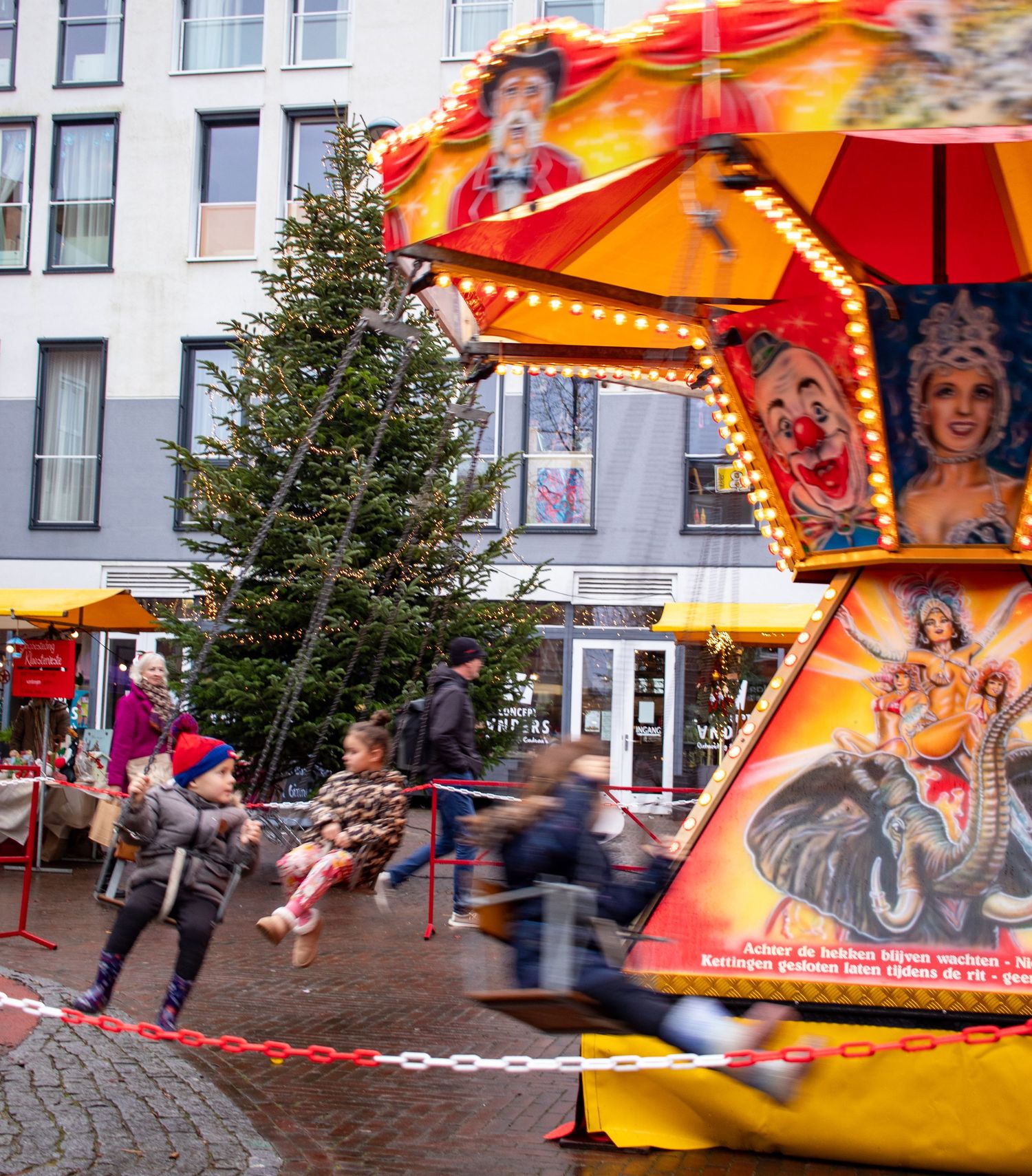 Kids enjoying the carousel a Christmas market