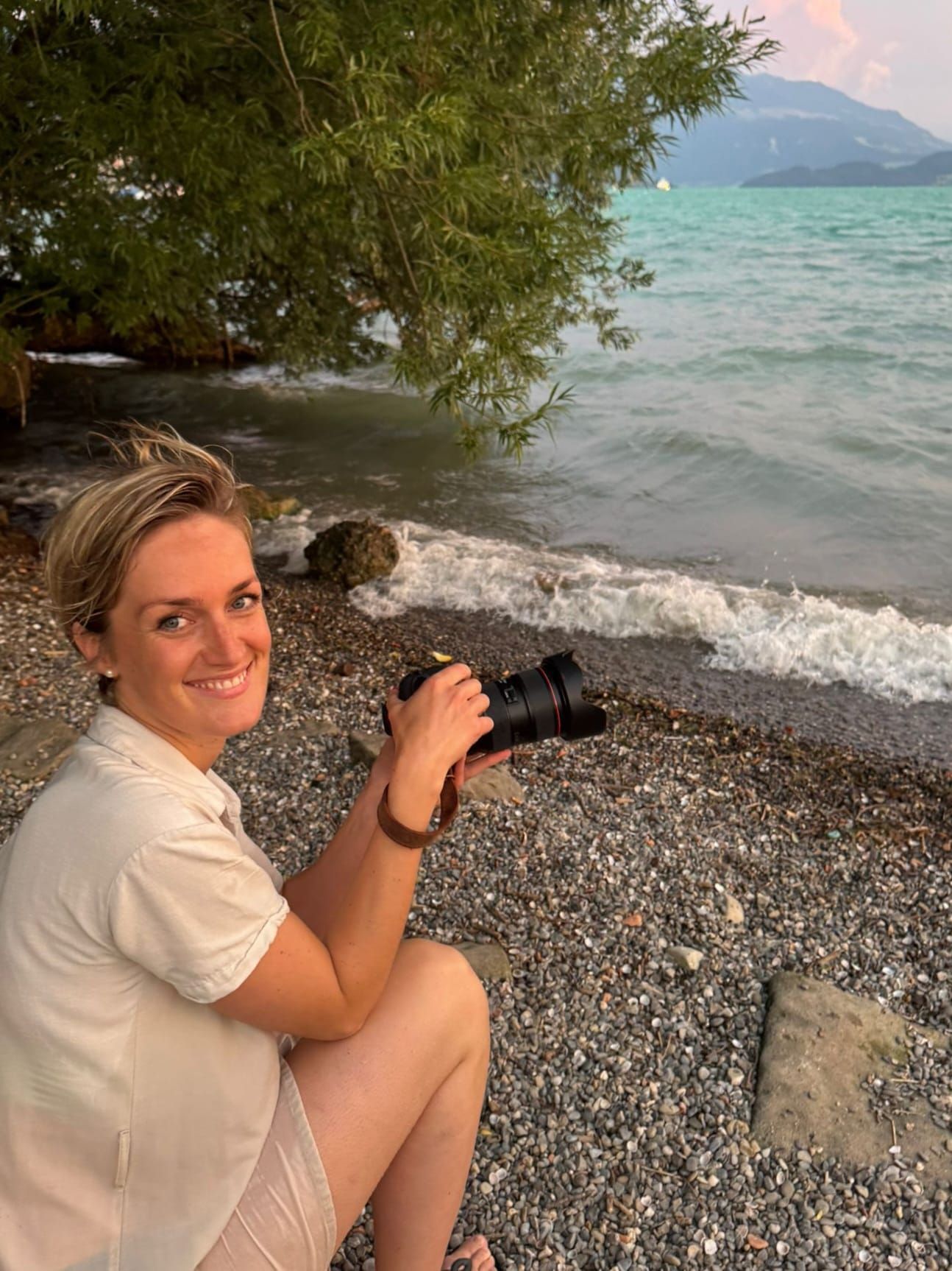 Photographer near the lake after a watershoot during golden hour