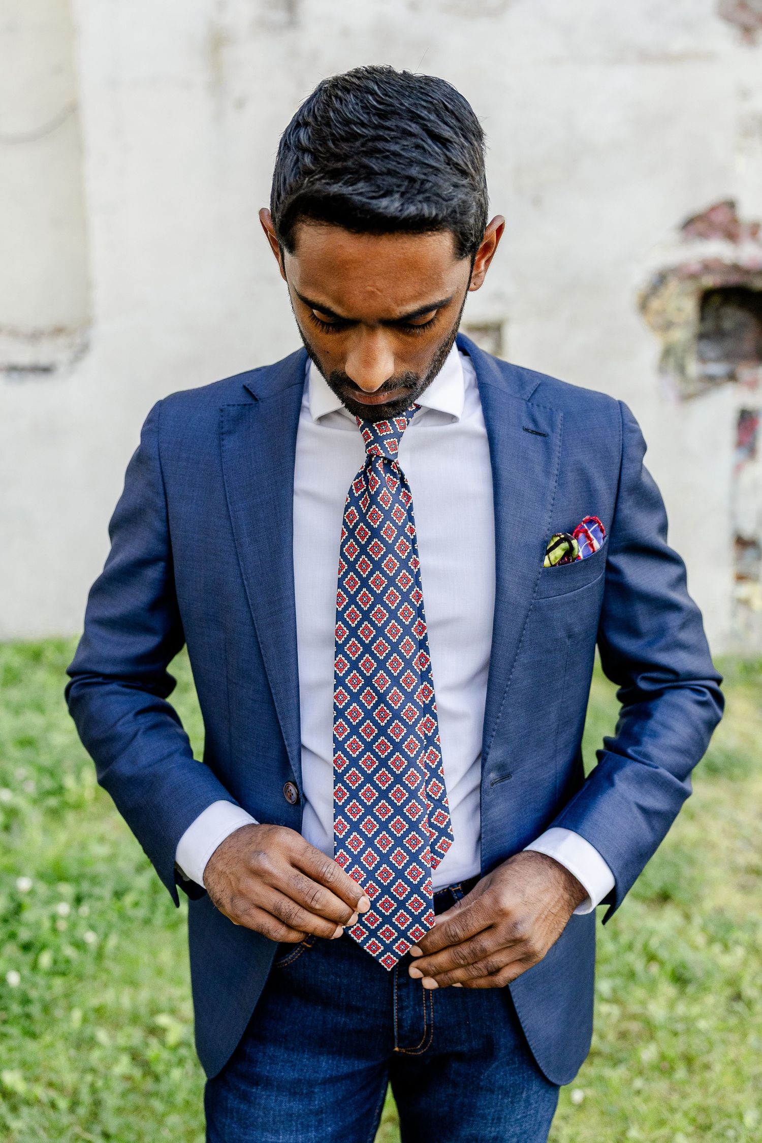 Businessman checks his tie during a branding photosession