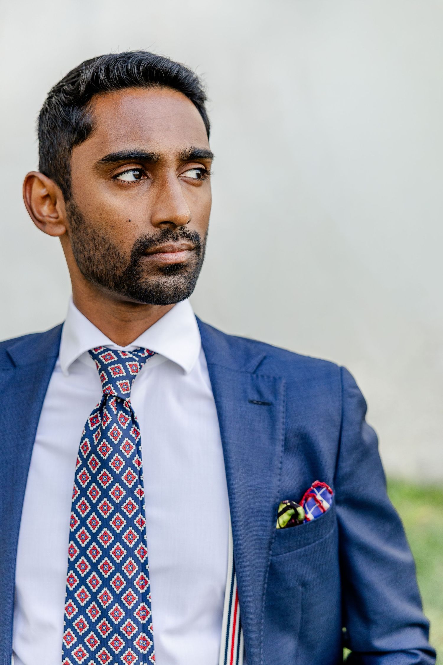 Business portrait of a business man wearing a blue suit