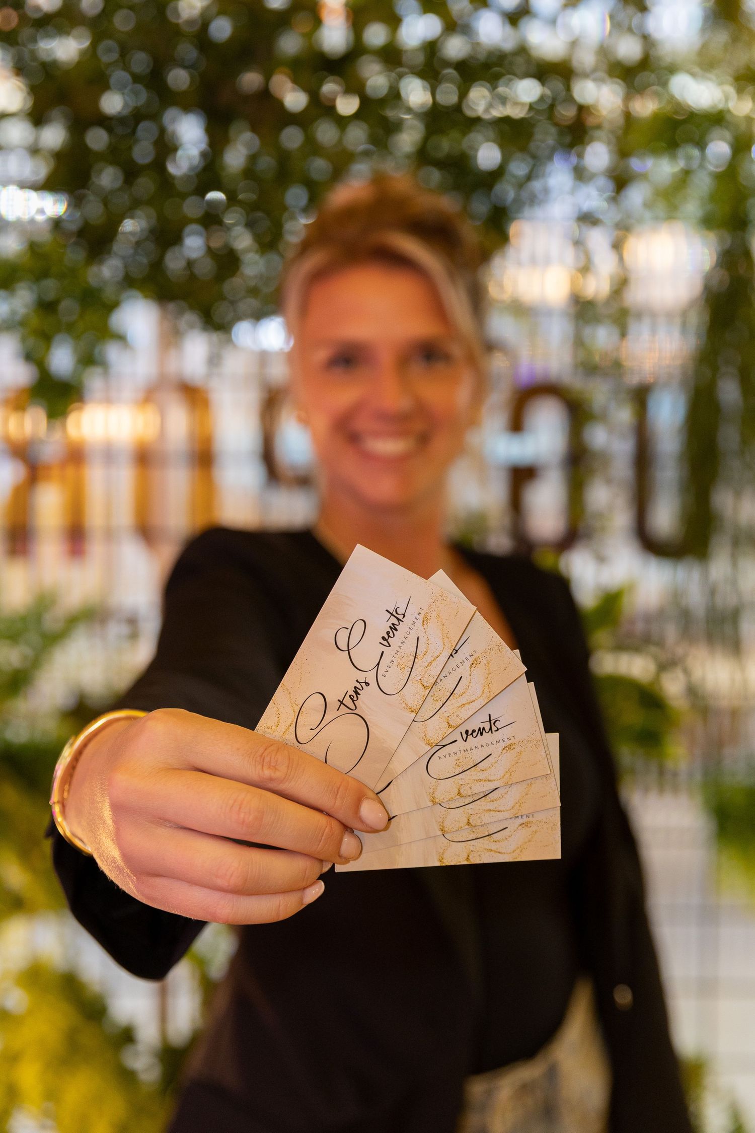 Event manager is showing her business cards