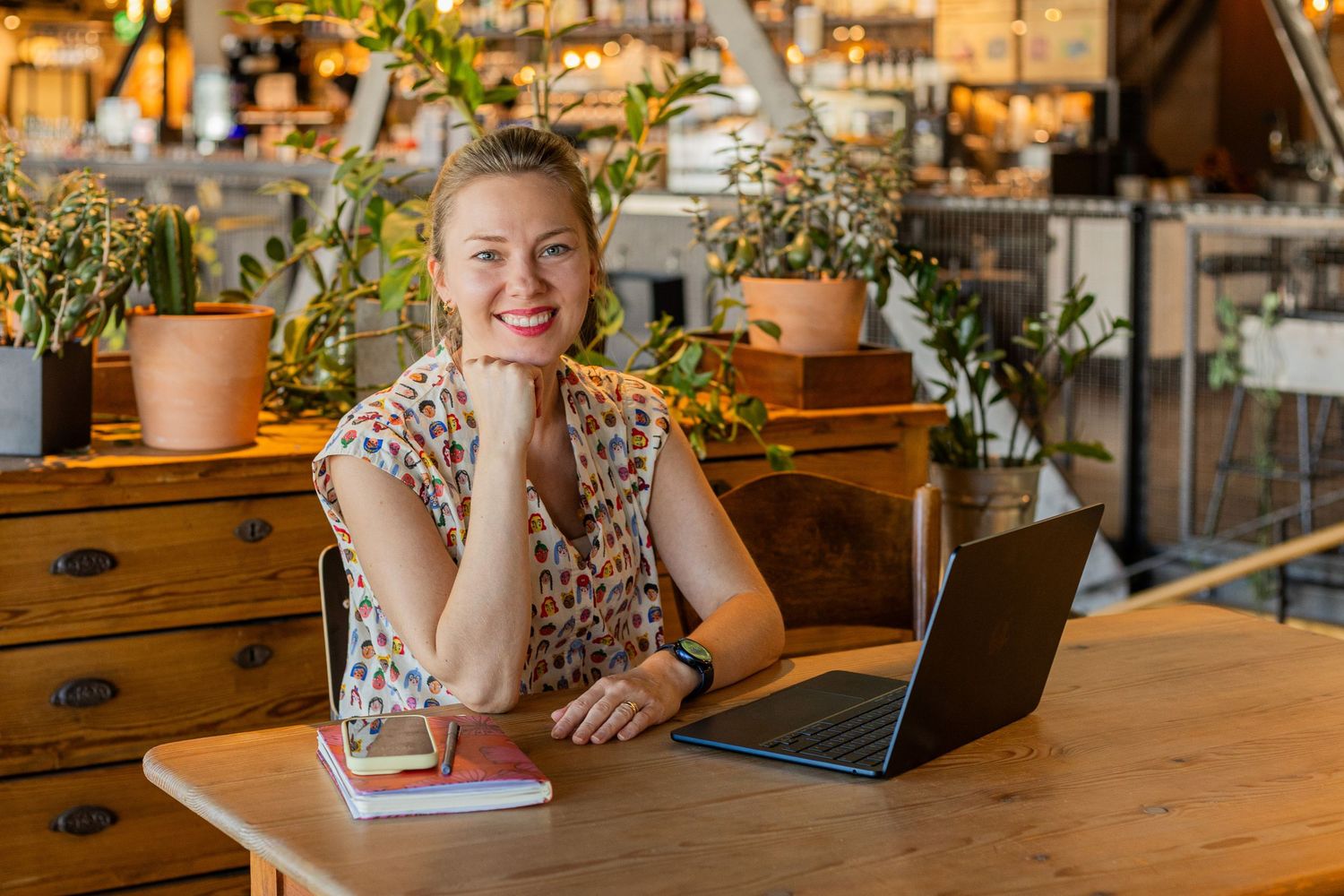 Female entrepreneur working on laptop during personal branding session in Zurich