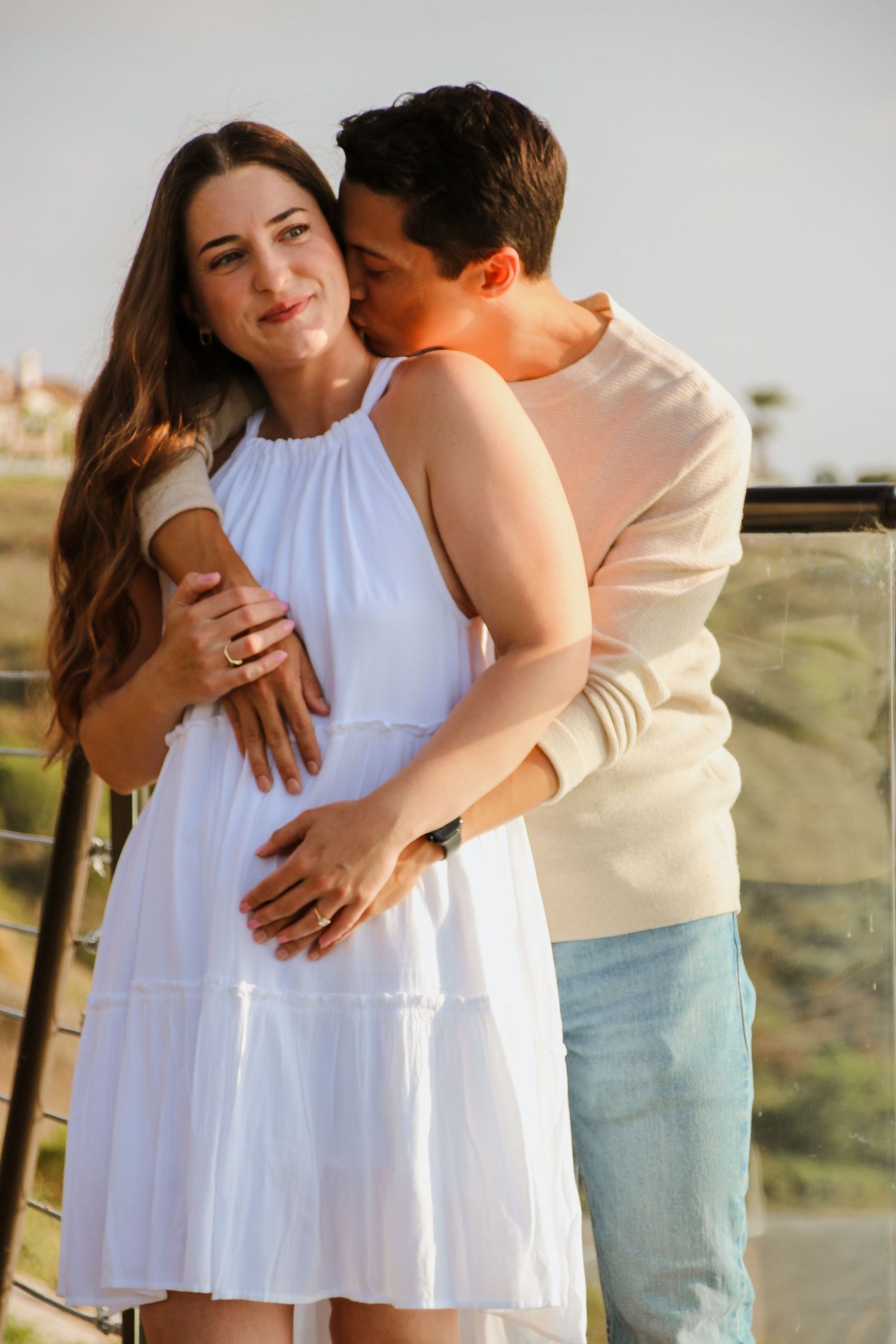Series of romantic couple portraits showing affection on scenic mountain overlook.