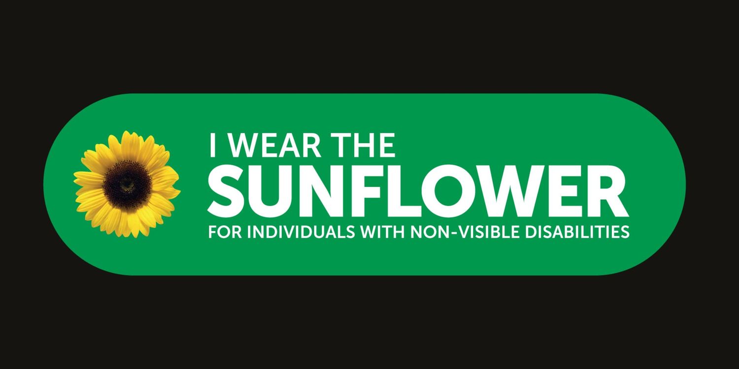 Green badge with sunflower logo reading I Wear The Sunflower for individuals with non-visible disabilities.