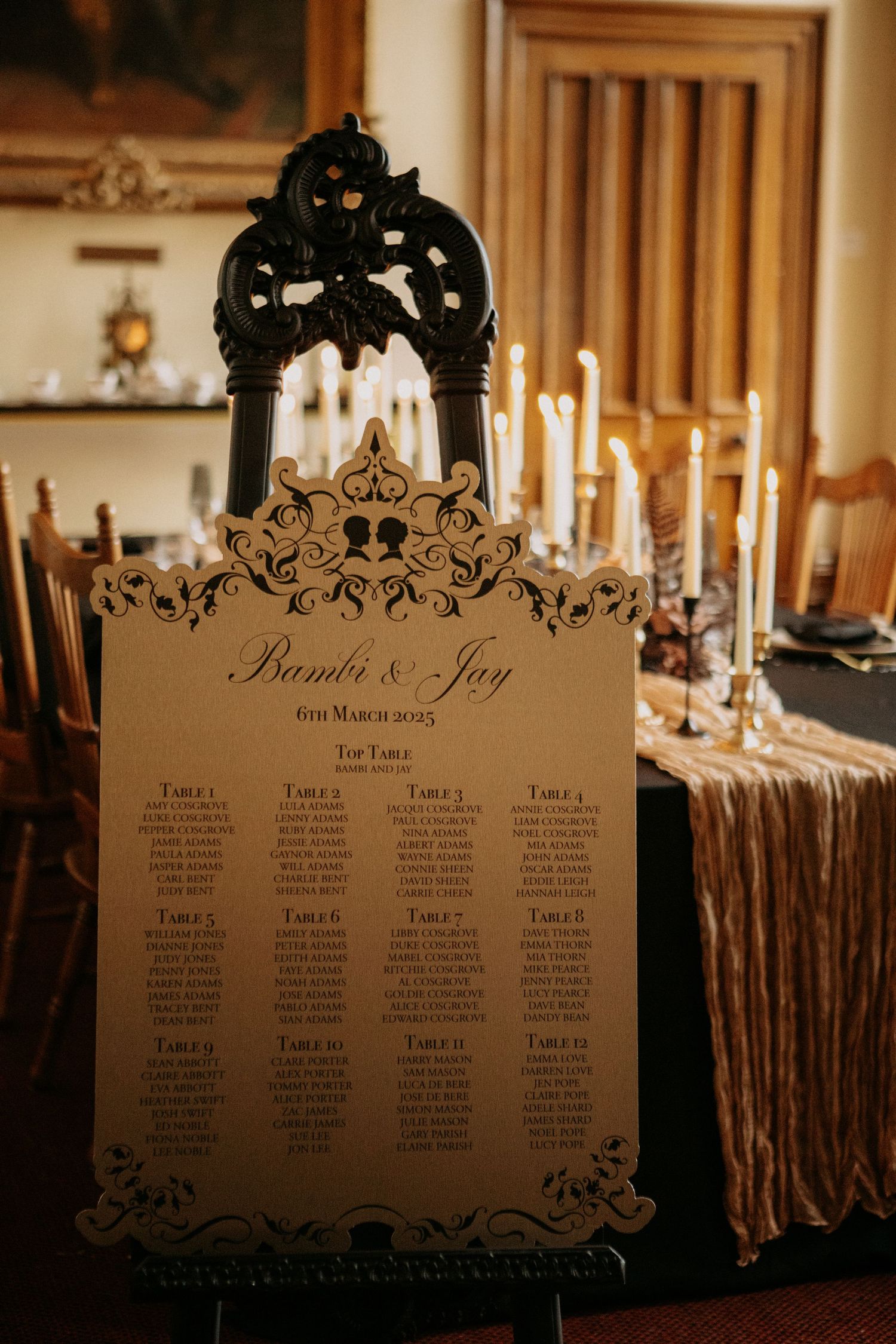 Ornate laser-cut seating chart for Bambi and Jay wedding dated 6th March 2023 with candlelit backdrop.