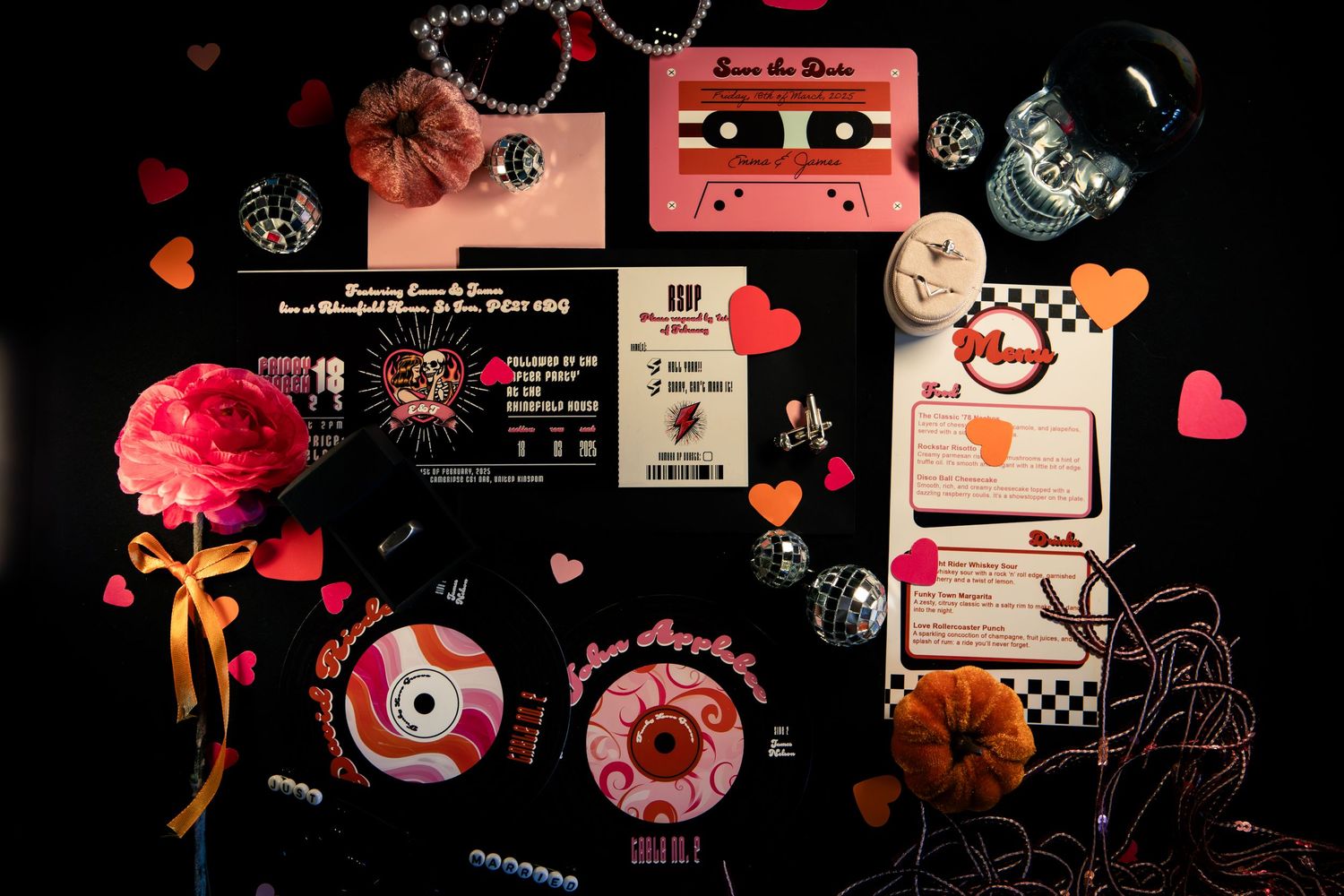 Retro-themed wedding invitation suite with cassette tape, vinyl record, checkerboard details, hearts, and disco ball on dark background.